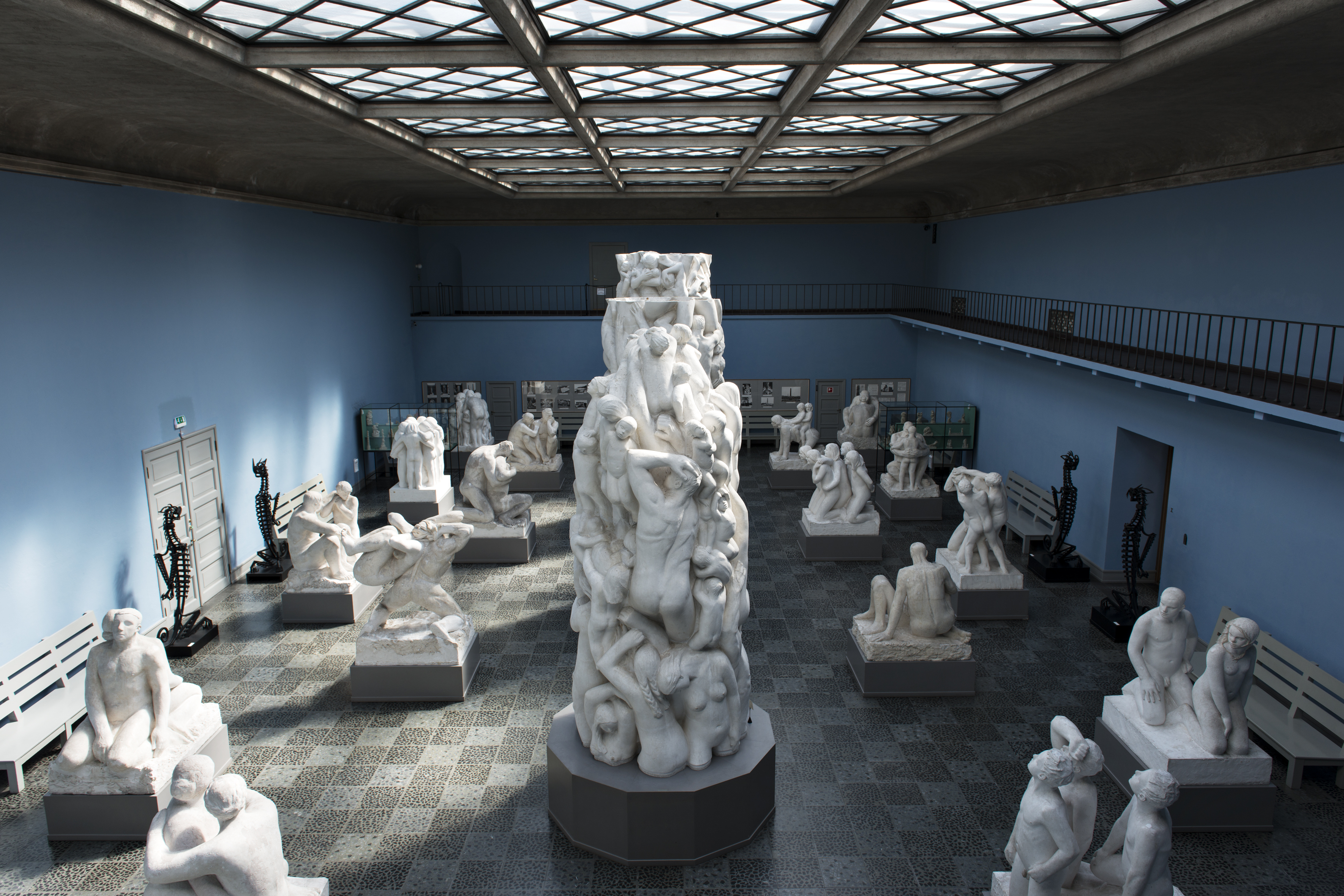 A section of the Monolith's plaster model displayed in the blue-walled Monolith Hall, surrounded by other plaster sculpture models.