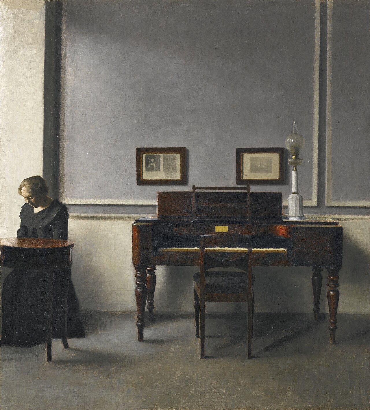 Ida at a piano in a quiet, light-filled interior painted by Vilhelm Hammershøi